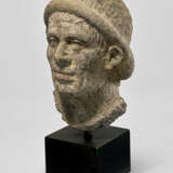 AN ETRUSCAN NENFRO PORTRAIT HEAD OF A MAN - photo 2