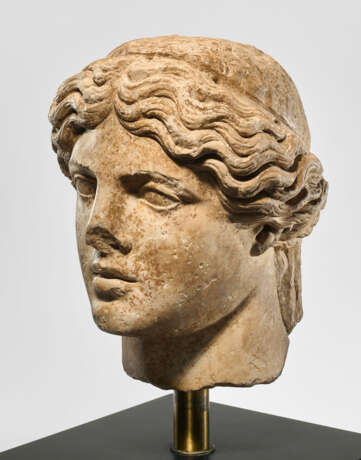 AN OVER-LIFESIZED ROMAN MARBLE HEAD OF APOLLO - photo 2