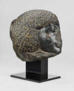 Nouvel Empire. AN EGYPTIAN GRANODIORITE PORTRAIT HEAD OF AN OFFICIAL