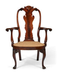 A MAGNIFICENT QUEEN ANNE CARVED WALNUT ARMCHAIR