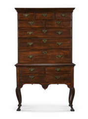 A QUEEN ANNE CARVED AND FIGURED MAPLE HIGH CHEST-OF-DRAWERS