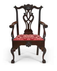 A CHIPPENDALE CARVED WALNUT OPEN ARMCHAIR