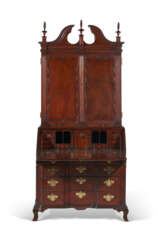 A CHIPPENDALE CARVED MAHOGANY BLOCK-FRONT DESK-AND-BOOKCASE