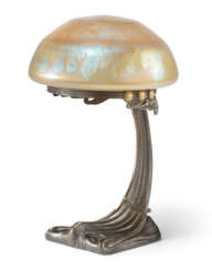 AN AUSTRIAN PATINATED BRONZE AND IRIDESCENT GLASS TABLE LAMP