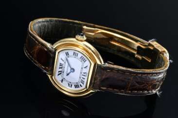 Cartier Ellipse Mini Gelbgold 750 Damenarmbanduhr, Handaufzug, weißes Zifferblatt, römische Zahlen, blauer Spinell auf der Krone, braunes Lederarmband, Original Faltschließe, Seriennr. 670810564, 1970er Jahre, 26,5x23,5m…