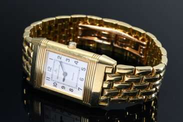 Jaeger-LeCoultre „Reverso“ Gelbgold 750 Damenarmbanduhr, Handaufzug, scharniertes Wendegehäuse mit Saphirglas, versilbertes Zifferblatt mit arabischen Zahlen und gebläuten Zeigern, massives Gliederarmband im Backsteinmus…