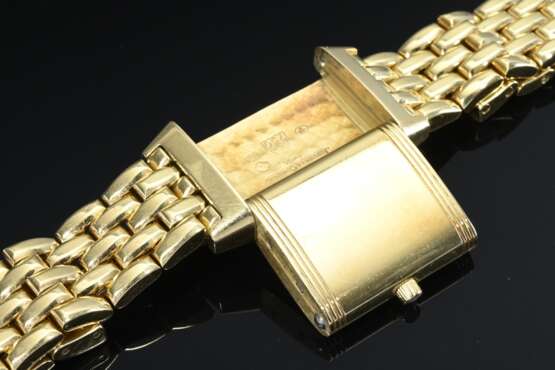 Jaeger-LeCoultre „Reverso“ Gelbgold 750 Damenarmbanduhr, Handaufzug, scharniertes Wendegehäuse mit Saphirglas, versilbertes Zifferblatt mit arabischen Zahlen und gebläuten Zeigern, massives Gliederarmband im Backsteinmus… - photo 5