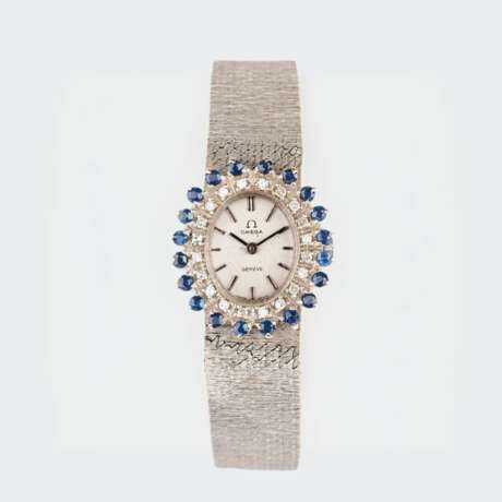 Omega. Damen-Armbanduhr mit Diamanten und Saphiren. - Foto 1