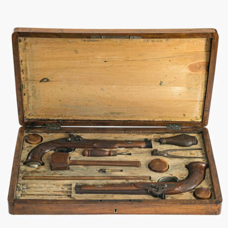 A pair of percussion duelling pistols with various accessories in a wooden box - photo 1