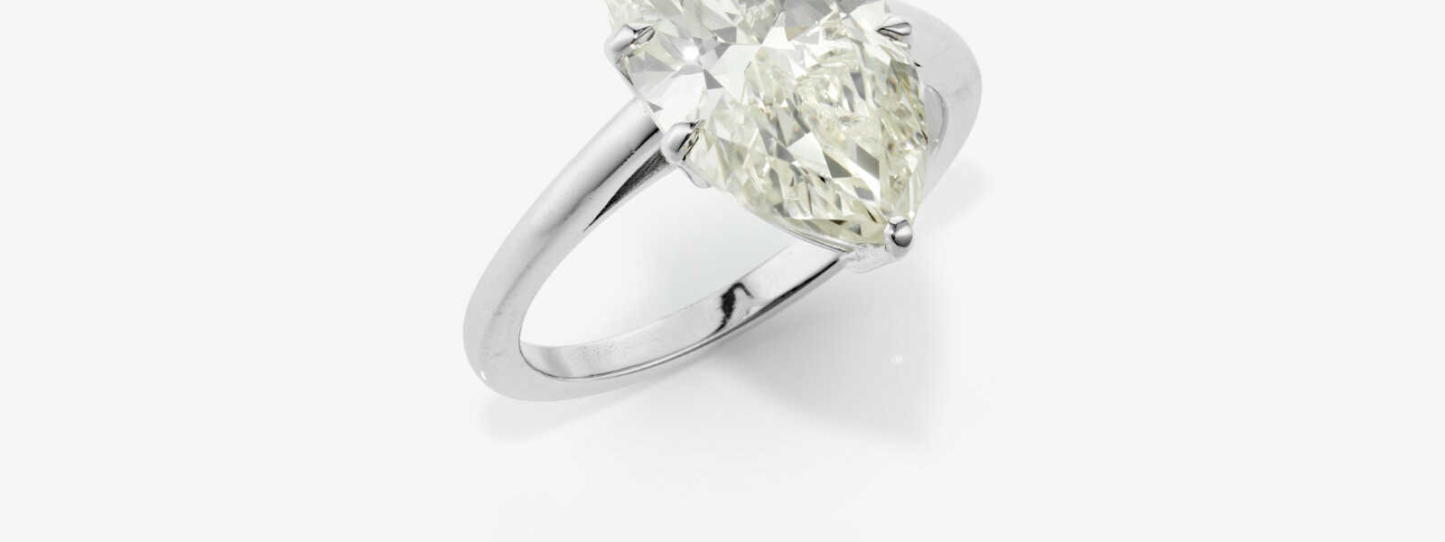 A puristic solitaire ring set with a marquise-cut diamond