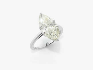 A puristic solitaire ring set with a marquise-cut diamond