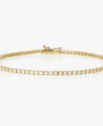 Handschmuck. Klassisches Brillanten besetztes Tennisarmband