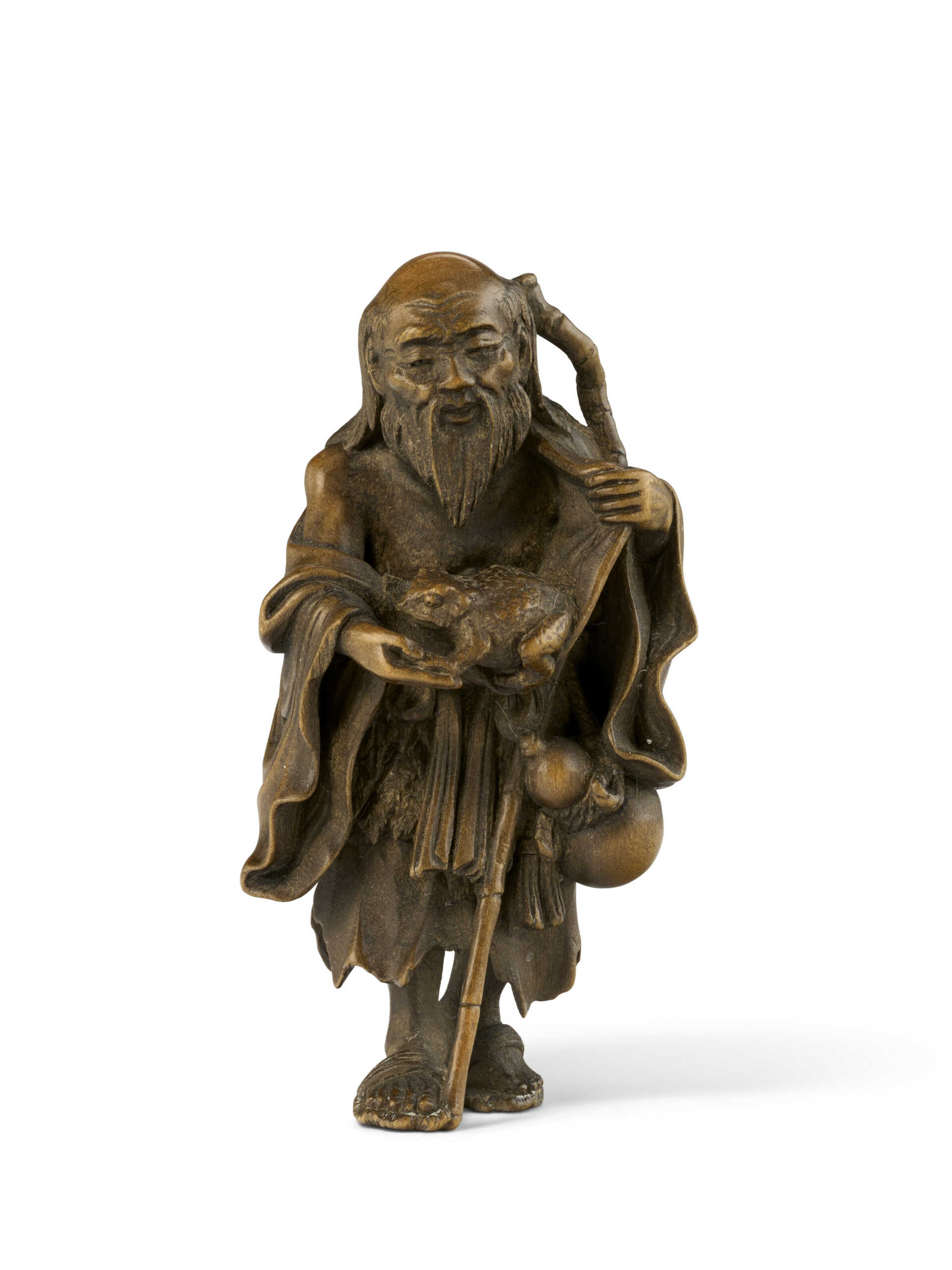 A WOOD CARVED NETSUKE OF GAMA SENNIN (TOAD IMMORTAL) A WOOD CARVED NETSUKE OF GAMA SENNIN (TOAD IMMORTAL)