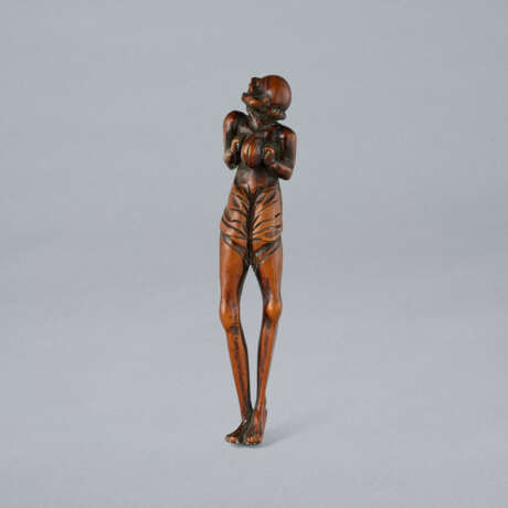 A CARVED WOOD NETSUKE OF ASHINAGA - photo 1