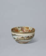 Porcelain. A SATSUMA BOWL WITH CHERRY BLOSSOM VIEWING SCENE