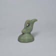 A CELADON STONEWARE SEAL WITH A FISH - Prix ​​des enchères