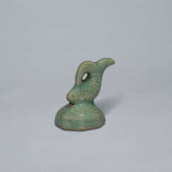 A CELADON STONEWARE SEAL WITH A FISH