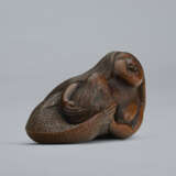 A CARVED WOOD NETSUKE OF A MERMAID HOLDING HER CHILD - photo 3