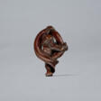 A CARVED WOOD NETSUKE OF A KAPPA STRUGGLING WITH A LARGE EEL - Auktionspreise