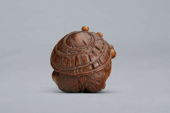 A CARVED WOOD NETSUKE OF A ONI UNDER HAT - фото 6