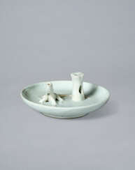 A WHITE PORCELAIN CIRCULAR INCENSE HOLDER WITH A DRAGON