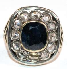 Ring, 750er GG, geprüft, ca. 5,6 g, Diamanten in Silber gefasst von ca. 0,85 ct. und dunkelblauer Saphir ca. 1,0 x 0,8 cm, RG 50, Innendurchmesser 15,9 mm