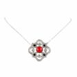Pendentif en platine avec diamants, onyx et caral sur une cha&icirc;ne en or. - Achat en un clic