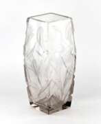 Overview. Large, heavy, crystal vase with luxurious irises. 