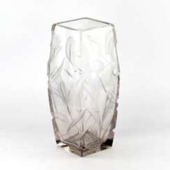 Large, heavy, crystal vase with luxurious irises. 