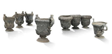 A SET OF EIGHT GEORGE III LEAD GARDEN URNS