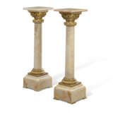 A PAIR OF FRENCH ORMOLU-MOUNTED ONYX PEDESTAL COLUMNS - photo 1
