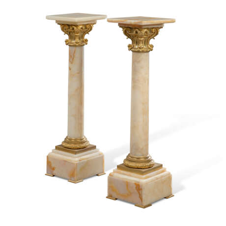 A PAIR OF FRENCH ORMOLU-MOUNTED ONYX PEDESTAL COLUMNS - photo 1
