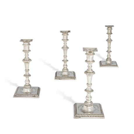 A SUITE OF FOUR GEORGE II AND GEORGE III SILVER CANDLESTICKS - фото 1