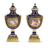 A PAIR OF ORMOLU-MOUNTED SEVRES PORCELAIN 'BLEU NOUVEAU' VASES (VASES CHAPELET) AND TWO COVERS - photo 1