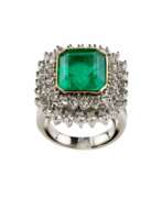 Product catalog. Platinum ring with emerald and diamonds. 