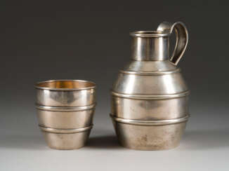 A SILVER DECANTER AND A SILVER BEAKER