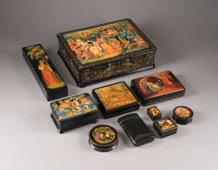 A COLLECTION OF TEN PAPIER-MACHÉ AND LACQUER BOXES DEPICTING FAIRY TALES
