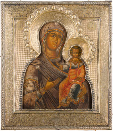 AN ICON SHOWING THE SMOLENSKAYA MOTHER OF GOD WITH A SILVER-GILT RIZA - photo 1