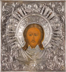 A SMALL ICON SHOWING THE MANDYLION WITH A SILVER OKLAD
