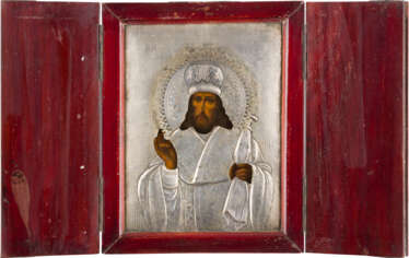 A SMALL ICON SHOWING ST. INNOKENTI OF IRKUTSK WITH A SILVER OKLAD WITHIN CASE
