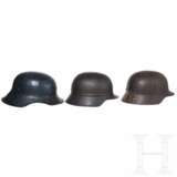 Sieben internationale Stahlhelme, 20. Jhdt. - photo 3