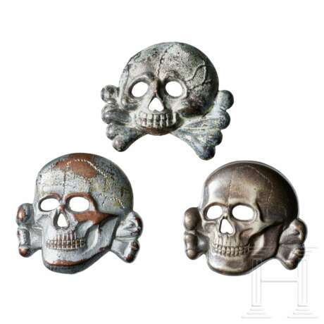 A Small Collection of SS Visor Cap Skull Insignia - фото 1