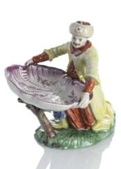 Menage in Form eines Türken mit Muschelschale