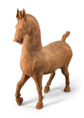 A LARGE CHINESE PAINTED POTTERY FIGURE OF A PRANCING HORSE