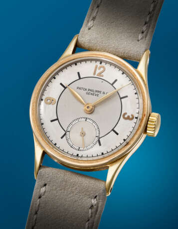 PATEK PHILIPPE. AN ATTRACTIVE 18K GOLD WRISTWATCH WITH TWO-TONE SECTOR DIAL - Foto 2
