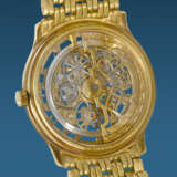 AUDEMARS PIGUET. A RARE AND ATTRACTIVE 18K GOLD AUTOMATIC SKELETONIZED WRISTWATCH WITH BRACELET - фото 3