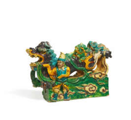 CERAMICS FIGURINE OF A RIDGE TURRET WITH MYTHICAL CREATURE AND STANDING MAN