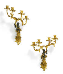PAIR OF BRONZE APPLIQUES WITH CUPIDS LOUIS XV