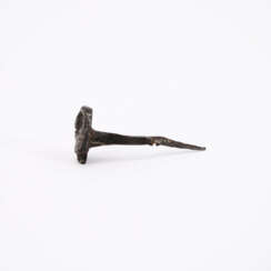 THREE EARLY IRON NAILS WITH FACES