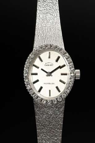 Ensi Weißgold 585 Damenarmbanduhr mit ovaler Brillant Lünette (zus. ca. 0.60ct/SI/W) und Faltverschluss an satiniertem Band, Handaufzug, 38,3g, L. 18,5cm, gangbar (keine Garantie auf Werk und Funktionalität) - фото 3